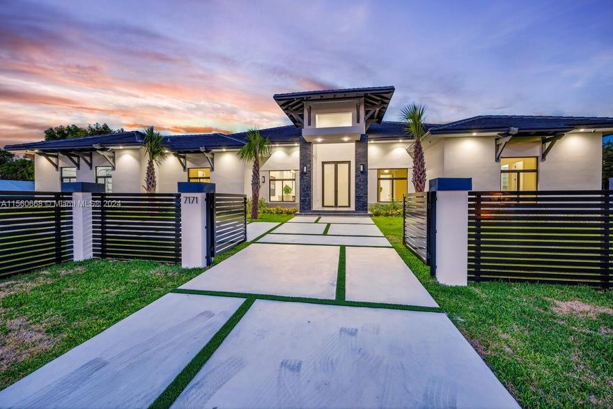 This newly built, sleek contemporary Glenvar Heights home, is set on a gated corner lot of 29,411 sq ft, adorned with impressive 12-foot ceilings. It features 5 bedrooms & 5 full bathrooms, including a cabana bath. The kitchen, is outfitted with a grand island, top-of-the-line Calacatta countertops, & a pantry space. The primary suite boasts high-end bathroom finishes & a spacious walk-in closet. Crafted for organization, each additional bedroom includes built-in closets. The home's ambiance is enhanced by smart-home technology & built-in speakers. An outdoor private oasis with a swimming pool, hot tub, & covered terrace is perfect for entertaining. A discreet 2-car garage on the side complements the home’s streamlined façade, marking this property as the pinnacle of upscale family living.