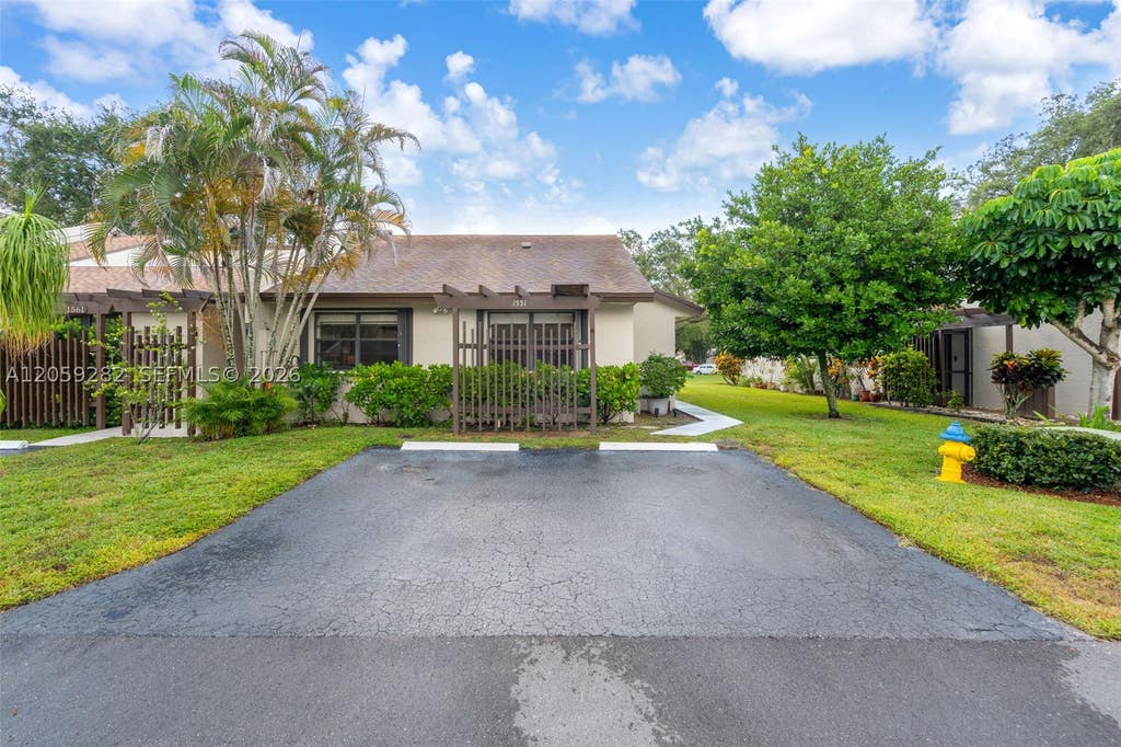 Photo of 1551 NW 98th Way, Pembroke Pines, FL 33024 (MLS # A12059282)
