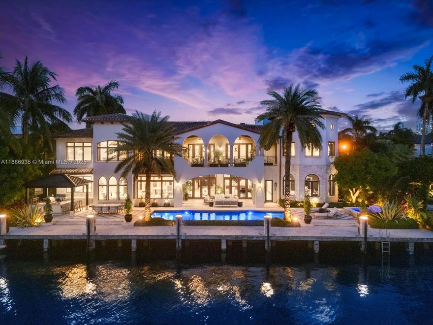 Welcome to uncompromising luxury in this waterfront sanctuary spanning nearly 9,000 sq. ft. For those who demand the extraordinary, blending striking design with resort-style living along 120 ft. of deepwater frontage & direct ocean access. The open floor plan features a grand living area, formal dining room, & state-of-the-art clubroom/theater. The gourmet chef’s kitchen boasts high-end appliances, a Miele coffee system, & ample butler’s pantry & adjoining 1,800-bottle wine cellar. Each bedroom enjoys en-suite bath, & for convenience, a maid's room & 2 laundry rooms. Crestron lighting & built-in surround sound elevate every space, delivering seamless indoor/outdoor living with an infinity-edge pool, sweeping balcony & expansive patio. Minutes from Las Olas dining, beaches, & golf.