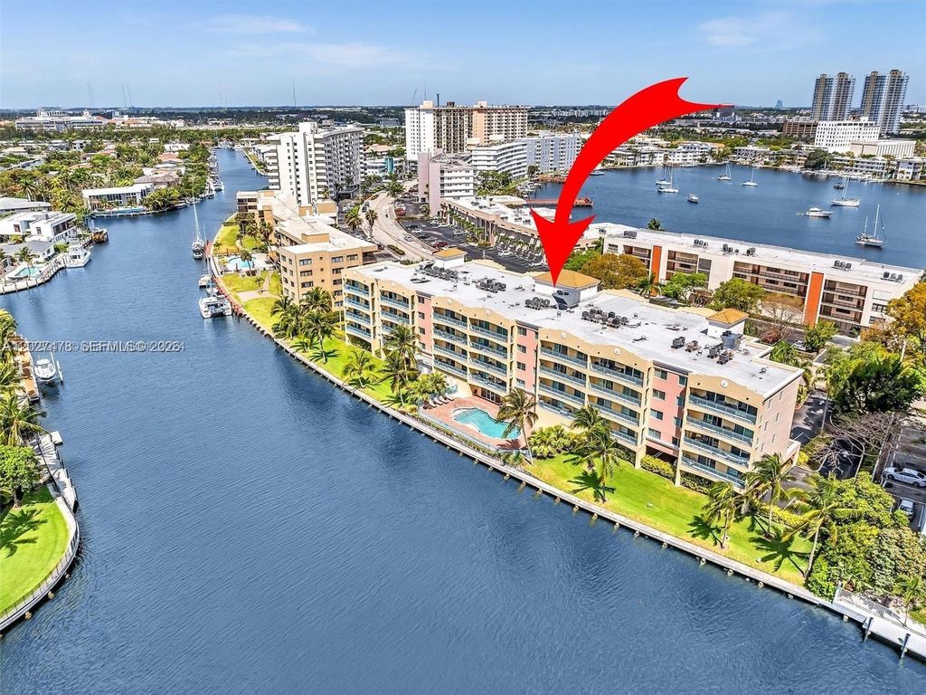Photo of 201 S Golden Isles Dr #306, Hallandale Beach, FL 33009 (MLS # A12027478)