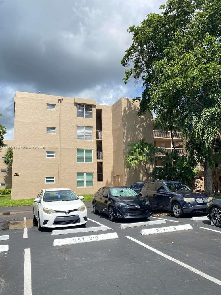 LARGE TOP FLOOR CORNER UNIT. 2 bed 2 bath unit with 1,100 sqf under air and screened in balcony with manual shutters and golf course views. Unit in need of updating/repairs/TLC. Unit conveniently located next to laundry room and staircase. Roof new. HVAC replaced several years ago and in great condition. Unit being sold as-is.