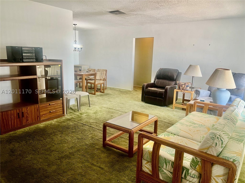 Photo of 4402 NW 43rd Ter, Tamarac, FL 33319 (MLS # A12011170)