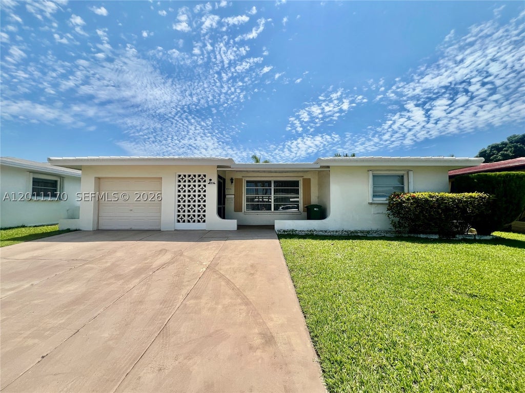 Photo of 4402 NW 43rd Ter, Tamarac, FL 33319 (MLS # A12011170)