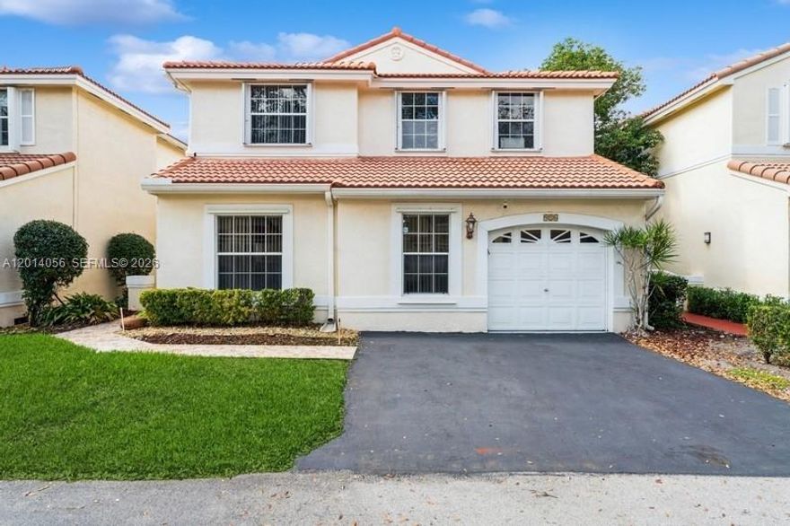 Welcome to Emerald Isle at Weston, where soaring ceilings, abundant natural light, and thoughtfully designed spaces create a warm and inviting atmosphere. This sought-after Arvida Topaz One model offers a spacious two-story layout with 4 bedrooms, 2.5 baths, generous living and dining areas, a family room, and a one-car garage. Dramatic volume ceilings and expansive windows fill the home with light, creating an open, airy feel throughout. The kitchen offers elegant countertops, stainless steel appliances, and a functional layout that connects comfortably with the home’s living spaces. Both full bathrooms have been beautifully updated, while the screened patio and private fenced backyard framed by tropical greenery create a peaceful outdoor setting for relaxing or entertaining. Perfectly positioned directly across from Tequesta Trace Park, the location offers immediate access to scenic walking paths, open green spaces, lighted athletic fields for soccer, football, and lacrosse, four baseball/softball fields, a roller hockey rink, skate park, and nearby recreation facilities including pickleball. Nearby schools (walking distance) and everyday conveniences are just moments away at Weston Lakes Plaza, with additional shopping, dining, and entertainment nearby at Weston Town Center, enhancing the convenience and appeal of this exceptional Weston location.