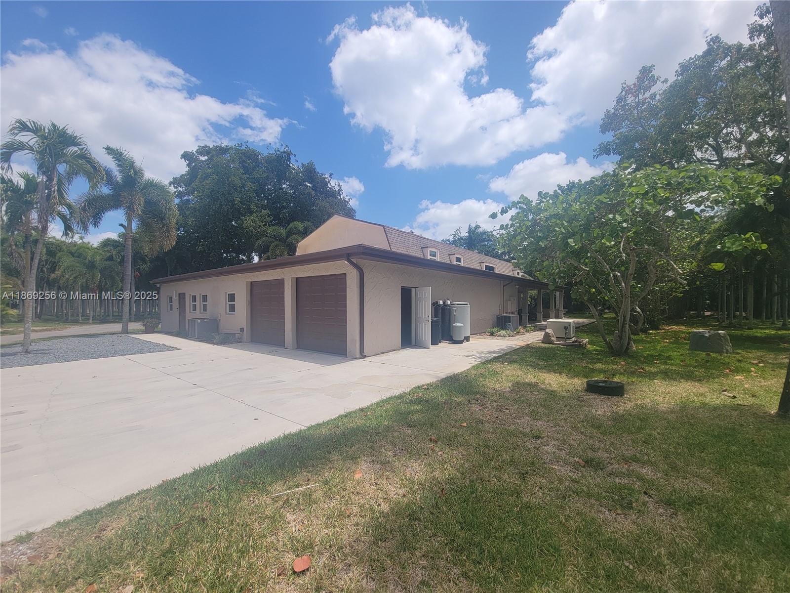 Stunning 5BD/5BA Single-Family Home on 3 Acres in Davie
This exceptional property offers 5 bedrooms, 5 bathrooms, and two full kitchens, making it ideal for large families or multi-generational living. Featuring a spacious open area perfect for meetings, a home office, or entertainment, the home provides flexibility for any lifestyle.
Set on 3 acres of beautifully landscaped land, surrounded by palm trees, a private lake, and lush natural scenery, this residence offers privacy and tranquility in a truly unique setting.
Located in the heart of Davie, the property is close to top-rated schools, parks, shopping areas, and provides easy access to I-75—combining serene living with unbeatable convenience.