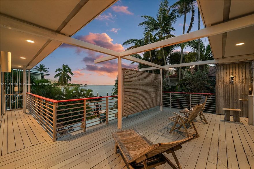 Nestled along the waterfront, in a quiet neighborhood in Coconut Grove this 2-story residence embodies an inviting & relaxing Grove vibe. The charming 4BR/4BA residence sits on a lushly landscaped, gated 6,862 SF lot, w/large private dock & 71’ WF on the tip of a protected waterway w/boat lift & direct access to the bay & ocean. 1st floor showcases polished concrete floors, an open living room w/wood-burning fireplace, kitchen w/granite countertops, private dining room w/access to the pool deck. 2nd floor principal suite features a walk-in closet, wood floors, dual bathrooms & access to a large wrapping terrace overlooking the pool & bay. Outdoor offers an oasis to relax w/covered terrace, seating areas, & heated circular pool. Located in the heart of the much-desired North Coconut Grove.