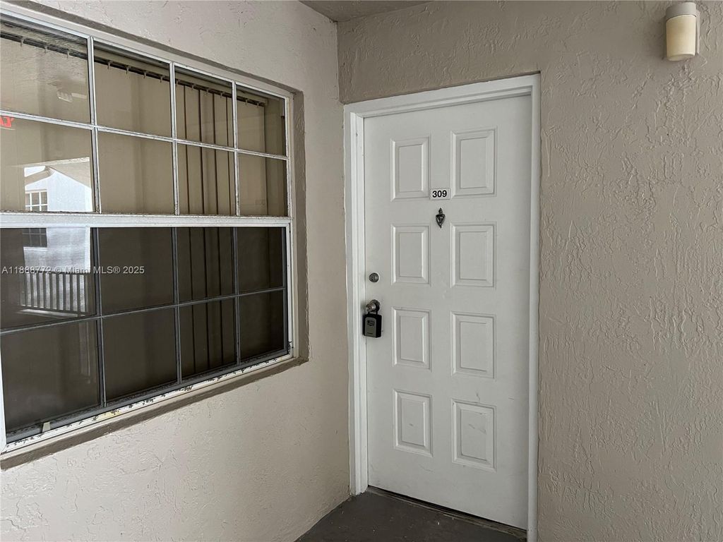 Photo of 2811 N Oakland Forest Dr #309, Oakland Park, FL 33309 (MLS # A11888772)
