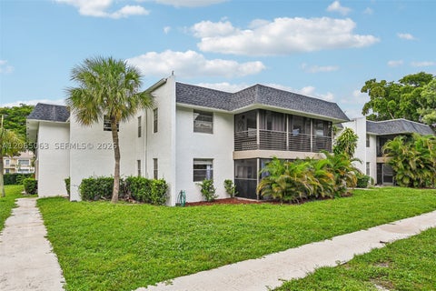Photo of 2830 Riverside Dr #103-3, Coral Springs, FL 33065 (MLS # A12065063)