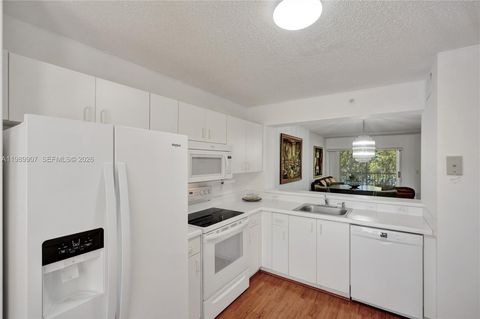 Photo of 9511 Weldon Cir #G306, Tamarac, FL 33321 (MLS # A11989907)