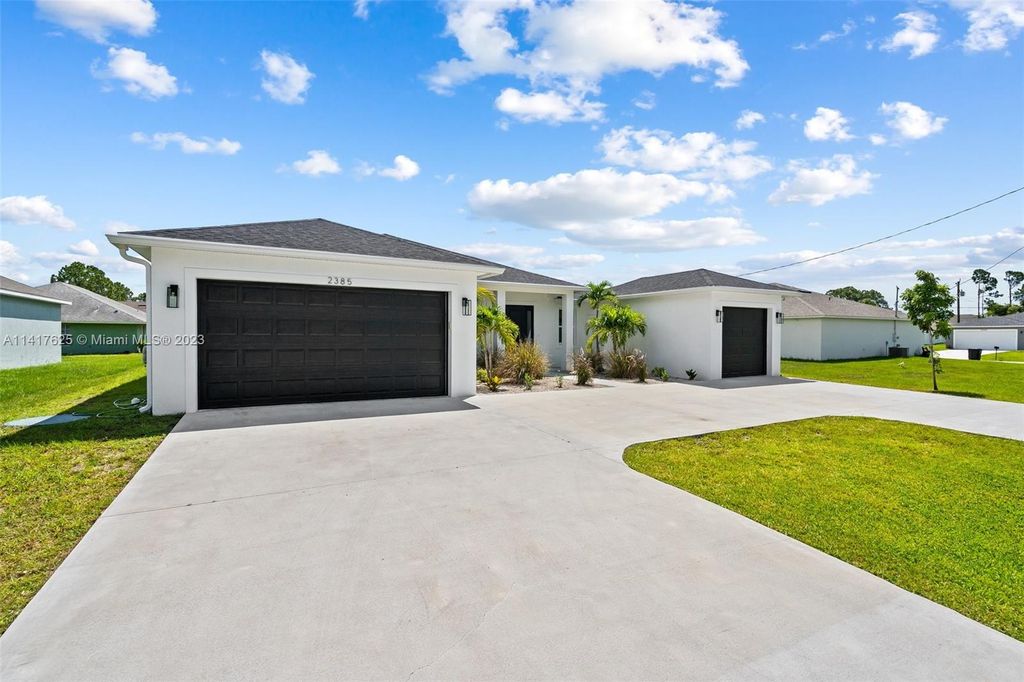 Photo of 2385 SW Import Dr, Port Saint Lucie, FL 34953 (MLS # A11417625)