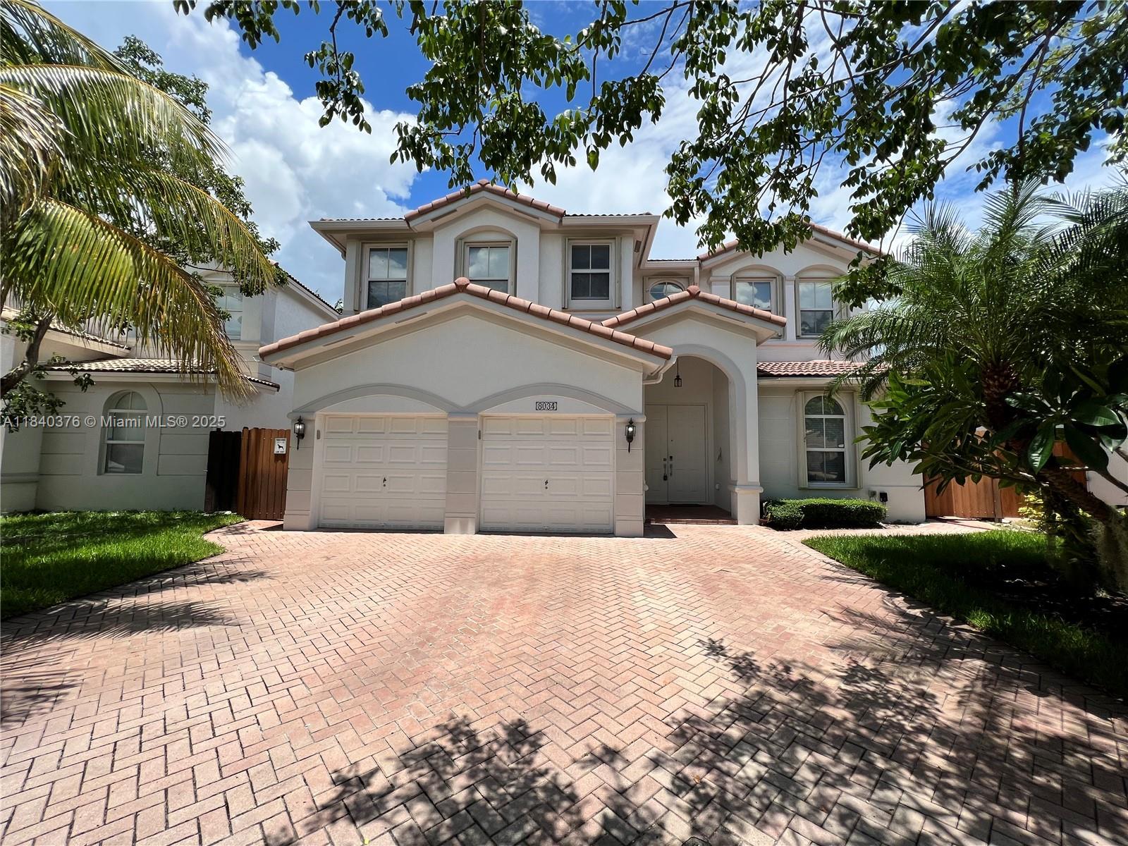 This two-story Isabella Model home features 4 bedrooms and 4 full bathrooms, including one bedroom and full bath on the first floor—ideal for guests or multigenerational living. It offers a paved patio with fenced yard and built-in Argentine BBQ grill. Interior highlights include marble floors downstairs, wood floors upstairs, stainless steel handrails, upgraded kitchen with quartz countertops and stainless steel appliances. Includes accordion shutters, window shades, ceiling fans, and 2-car garage. Located in Island at Doral, with access to clubhouse, tennis courts, gym, pool, kids’ playground, and party room. Zoned for A+ schools and close to major expressways, Florida Turnpike, Miami Airport, restaurants, and shopping including International Mall.