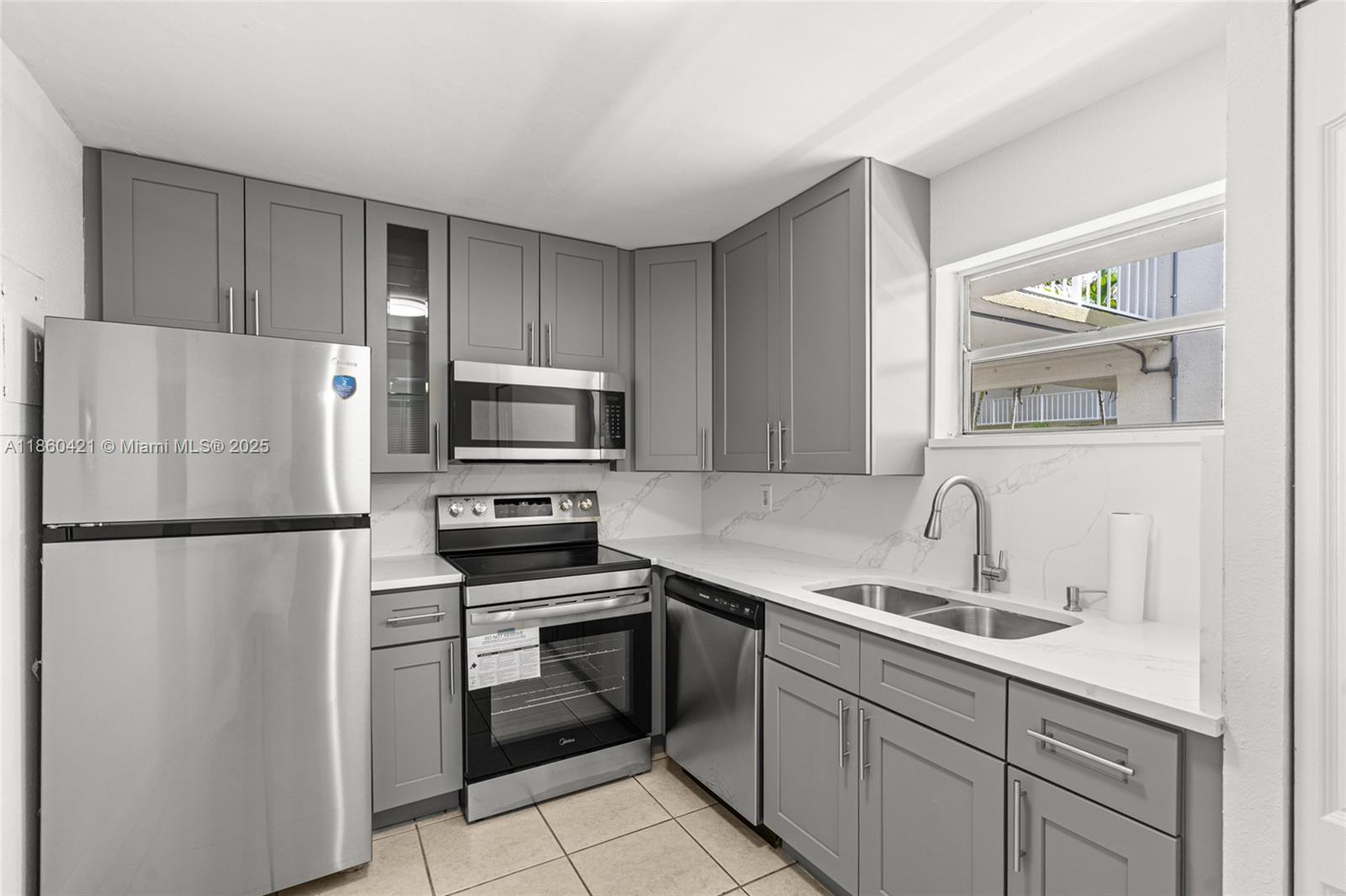 Spacious 2-bedroom, 2-bath condo located in the desirable Springcrest community of Sunrise. This beautifully updated unit features a brand-new kitchen, bathrooms, and flooring. Enjoy a large living and dining area that opens to a screened balcony. The primary suite includes an upgraded bathroom with double sinks. Additional highlights include laundry facilities on the same floor, one assigned parking space plus guest parking, and a variety of community amenities such as a clubhouse, pool, gym, playground, and tennis courts. Conveniently located near major highways, shopping, and dining, this home combines comfort and accessibility.