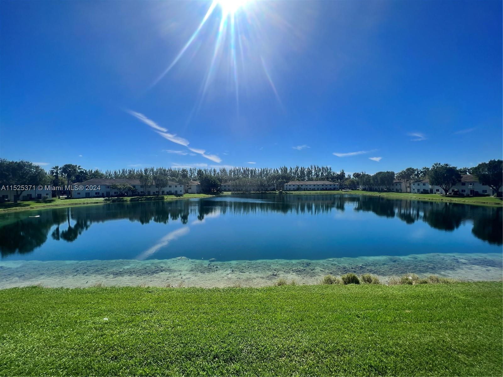 Step into your Dream home with a stunning Lake view that will capture your heart. This beautiful condo offers a tranquil retreat with fresh white interiors, 2 large bedrooms, 2 baths, & a walking closet. The bright living spaces include an eat-in kitchen, living room and the convenience of in-unit W&D. Unit is just steps from the entrance & a sparkling swimming pool, +park right next to your front door, this low-maintenance unit is a true gem. Walk to the new Publix, enjoy top-ranked schools, & relish proximity to Mayor Roscoe Warren Park with its amenities including a large dog park!! Ideal for both investor & first-time homebuyers with low down payment. Don't miss out on this sweet retreat; The seller is even ready to contribute to your closing costs. Act fast, as this gem won't last!
