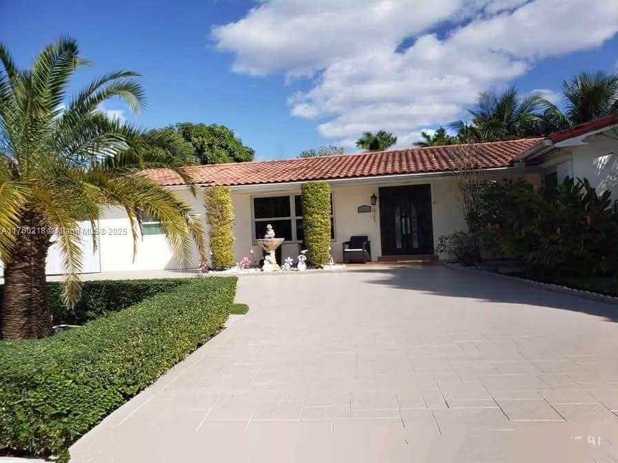 Welcome to your dream home, located near the university, expressways, and shopping centers. This stunning four-bedroom, four-bathroom residence blends luxury and comfort.
The spacious kitchen features a sensory sink and modern fridge with a built-in tablet. Enjoy light in the family room and host dinners in the elegant dining room. Updated fixtures in the bathrooms add a modern touch.
Convenience is key with an updated washer and dryer, plus a separate guest suite with its own entrance and patio. Outside, a tiki area and lush mango and coconut trees create a tropical oasis. The expansive patio is for entertaining.
Located in a family-friendly neighborhood, this home boasts fresh exterior paint and a healthy interior environment.