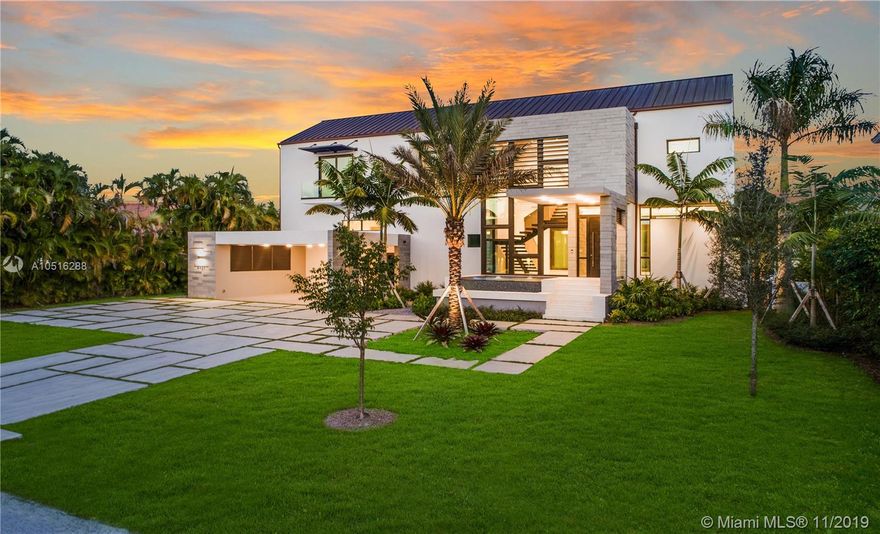 Modern Miami waterfront luxury scaled for gracious living. Thoughtfully conceived, elevated new-construction sited in an intimate, highly sought gated Gables enclave. Ingenious design maximizes every sq ft of lot space. Refreshingly understated interiors; elegant, airy floor plan masterfully flows & functions. Living & dining rooms offer water views. Gleaming Wolfe/Subzero kitchen w/wine cellar & pantry. Sublime master w/sumptuous bath, office, H&H walk-ins, sundeck & outdoor shower. All bedrooms en suite! Wow-factor exterior; kitchen/living/dining & fabulous pool/spa w/island seating & sundecks. New batter-pile fortified seawall; 70-ft dock; no bridges to bay. Rooftop deck affords city views. Built for the ages w/poured concrete, copper, limestone & oak. It’s all that and more!