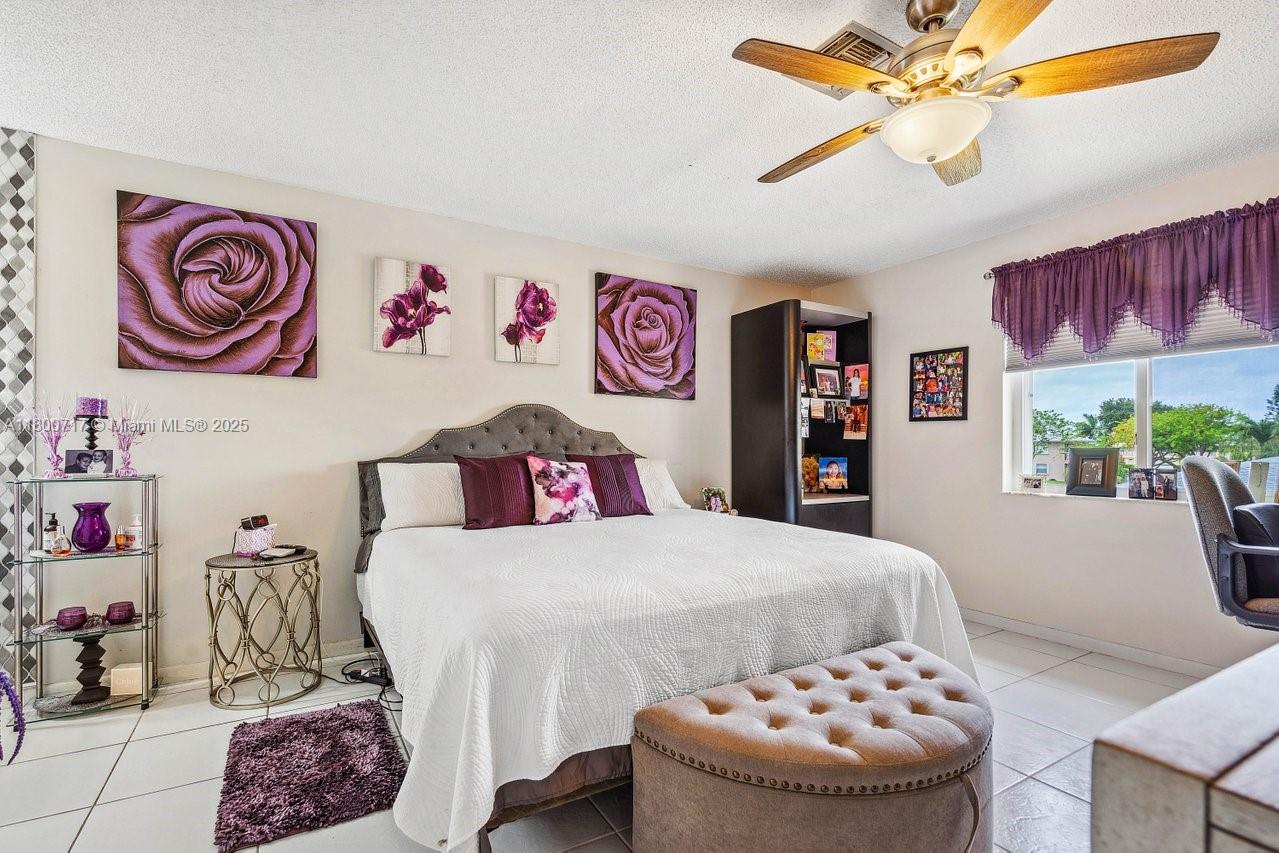 Don't miss out on this new price! Welcome to this meticulously maintained 2 bed, 2 bath condo in the vibrant 55+ community of The Pines of Delray North. Just 15 minutes to Delray Beach and the restaurants and shops of Atlantic Ave, this spacious 1,335 sq ft unit offers a large living/dining area, a primary suite with a tile accent wall, updated vanity, and dual walk-in closets. Enjoy the convenience of a washer/dryer in-unit and an additional storage space. The manned gated community amenities include cable and internet pools, tennis, fitness center, and daily social activities. Ideal for active adults seeking style and value!