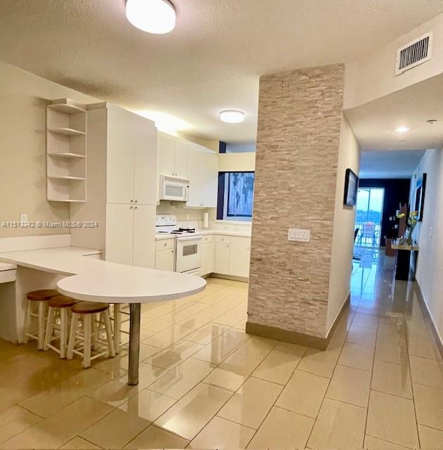 Come and see this well maintained 3-bed /2-bath unit, with a great open concept floor plan, located at the resort-style gated community of Doral Isles. Offering stunning lake views and the best club house in Doral, with 3 pools, kid's park, fitness center with classes, tennis/basketball courts, and sports fields. Safety is ensured with 24/7 security. Easy Turnpike/Palmetto highway access, Dolphin Mall nearby, and top public/charter schools plus FIU close.