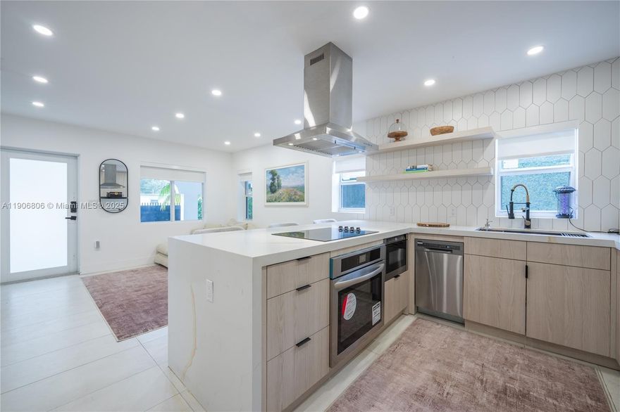 Miami’s prime location. Design District, Midtown, and Wynwood, Edgewater, offers convenient access to Downtown, Miami Beach, and the airport. Modern design, every aspect of this home has been carefully renovated to offer the perfect blend of luxury, comfort, and functionality. At the center of the home is a spacious chef’s kitchen, designed to impress. The master bedroom features a luxurious king-sized bed, while the two guest rooms each include comfortable queen-sized beds. Entertainment is endless with a variety of in-home amenities, including a golf setup. Step outside to enjoy a BBQ grill or relax in the oversized 9-person salt water hot tub, perfect for unwinding after a day in the city. Big front porch.