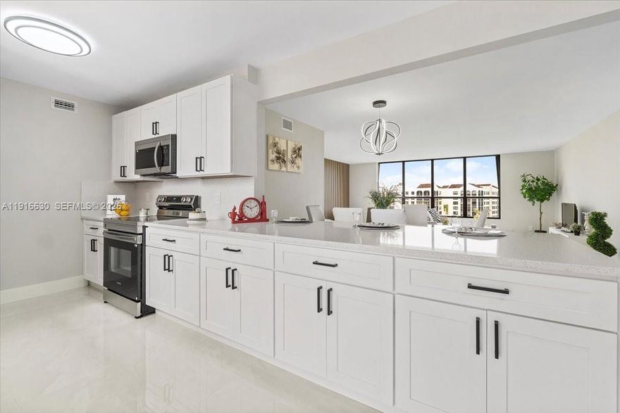 Discover refined living in this exquisitely renovated 3BD/2BA condominium in the highly desirable Boca Pointe community. This elegant residence offers breathtaking golf-course views, a spacious open layout, and premium porcelain tile flooring throughout. The beautifully updated kitchen and baths bring a modern, timeless feel to the home. The primary suite features an impressive walk-in closet, and all bedrooms include custom closets for exceptional organization. Enjoy peaceful mornings and golden-hour sunsets from your private balcony overlooking pristine fairways. A truly turnkey home offering style, comfort, and the distinguished Boca lifestyle.