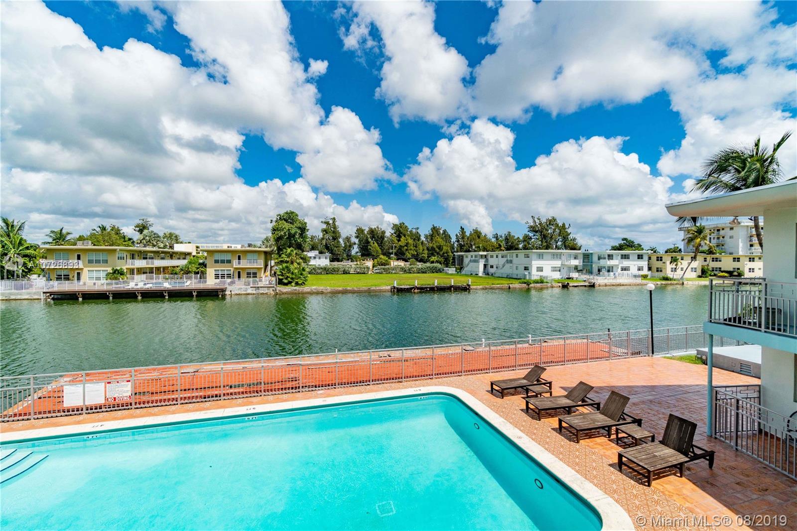HUGE REDUCTION,, Seller wants offers! Step into this original Art Deco condominium right on Normandy Waterway in Normandy Isle, Miami Beach and you will find yourself wanting to stay. The bright and cheery 2 bedroom 1.5 bathroom unit has refinished original wood floors, updated bathroom and kitchen, New central A/C, new window blinds, new roof, and washer and dryer. The community has a waterfront Pool and Designated Barbecue pavilion. Minutes to the beach and all that Collins Ave has to offer. Short drive to South Beach with all it's shops, restaurants and Nightlife. Convenient to Miami International Airport and Interstate 95.