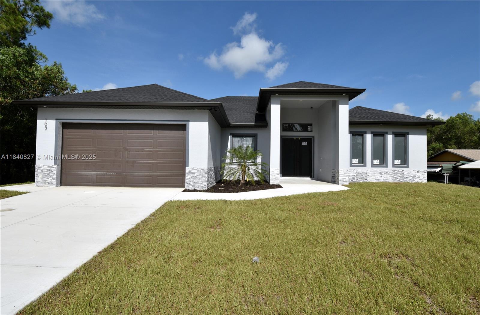 New construction home, 3 bedrooms with a Den/ office and two bathrooms. featuring: primary bathroom with wall tile all the way to the ceiling, 96" tall interior doors and Impact resistant windows and exterior doors. Security cameras installed at exterior areas, includes a 50" Tv!. Lots of cabinet space all around the kitchen area including Stainless steel kitchen appliances. In-house laundry area with wall cabinets and Quartz counter tops and a wash station. Spacious two car garage with an additional side door. Soffit light at front. Concrete driveway with a sidewalk to the side of the garage. Make your appointment today!.