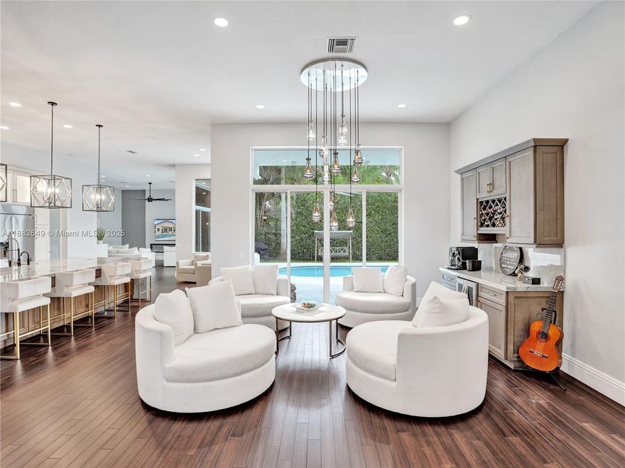 Exquisite 5BD/4.5BA/3CG nestled on a generous 10,000 sqft corner lot in the exclusive enclave of WHCC. Updated open floor plan includes showpiece remodeled gourmet kitchen at the heart of the home w/ huge quartzite island/countertops, high end appliances + eat in nook, custom dry bar w/ wine fridge, Cali Bamboo & Eucalyptus floors, modernized bathrooms, flush LED lighting, electric fireplace + smart electric shades in fam room, 20K designer chandelier in liv room. Additional updates incl new AC (2025), 2nd unit (2022), hybrid water heater (2024), Aug 2019 roof. Heated saltwater pool w/ marble tile deck, pool heater (2025), variable-speed pump (2024). Smart tech includes security cameras, EV charger, and app-controlled shades. Exterior freshly painted (2025). Move-in ready luxury!