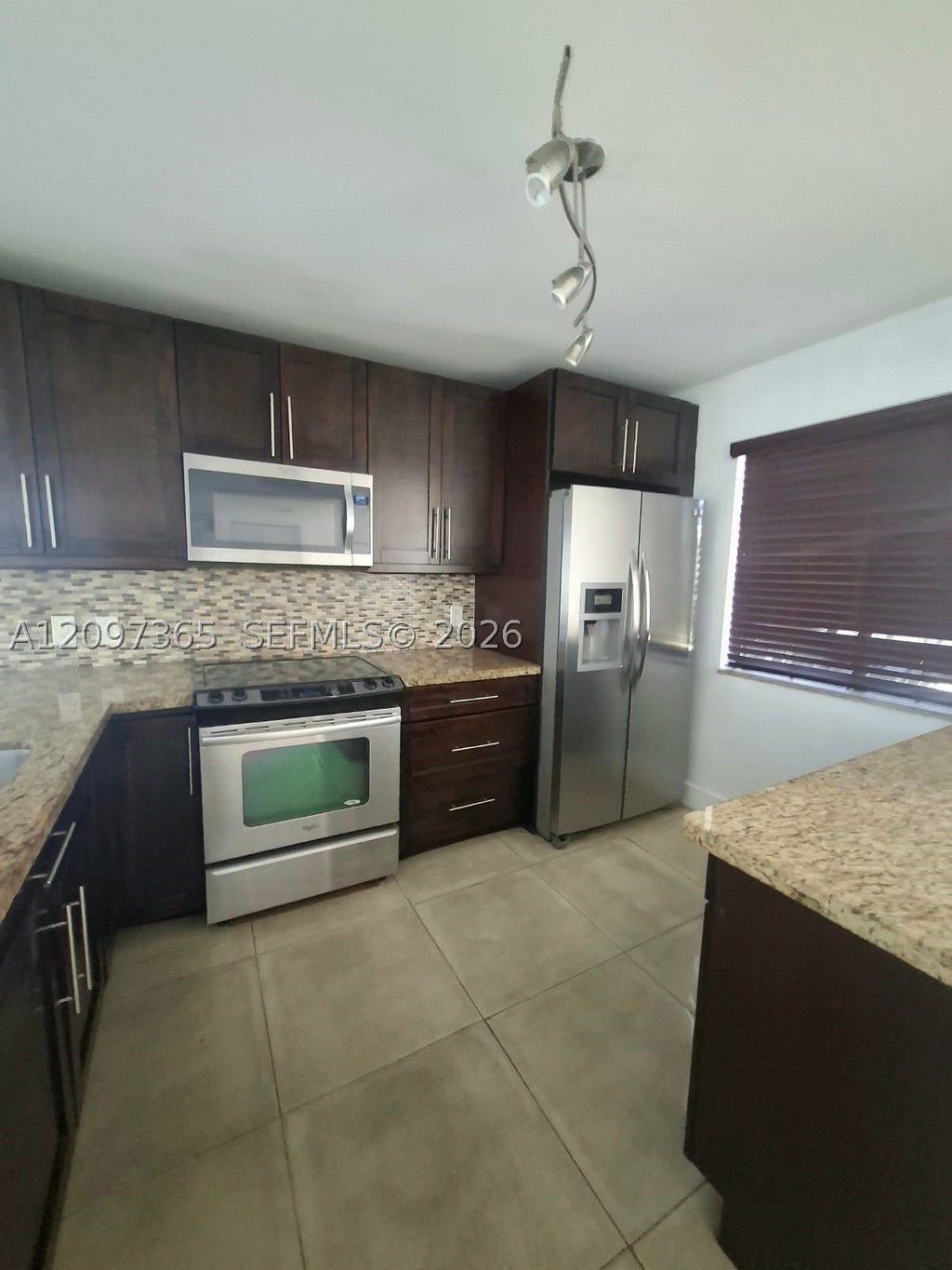 Photo of 320 Racquet Club Rd #104, Weston, FL 33326 (MLS # A12097365)