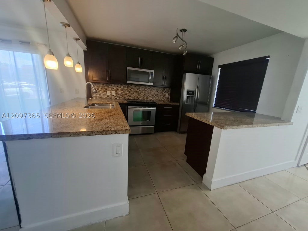Photo of 320 Racquet Club Rd #104, Weston, FL 33326 (MLS # A12097365)