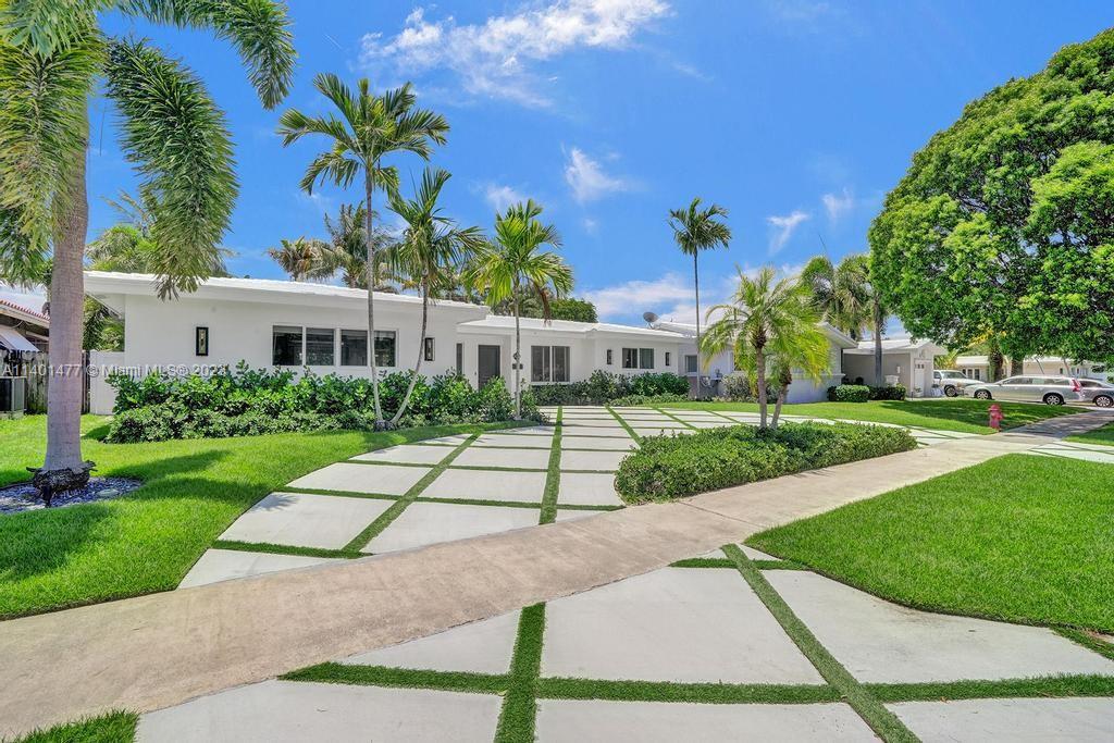 This stunning oasis will transport you to a mid century tropical paradise. This bright 3 bedroom home in Imperial Point offers crisp finishes, open living spaces and is lined with impact windows and doors. The generous floor plan is flooded with natural light and has a renovated kitchen and bathrooms, tile & wood laminate floors & custom lighting. The beautiful back yard is complete with a sparkling pool that will make you feel like you're on vacation every day. Home also has Tesla charger, built-ins in every closet, Built out pantry, laundry room & tankless hot water heater. Amazing location - a few miles to the beach & close to great schools. Rent includes pool and lawn maintenance.
