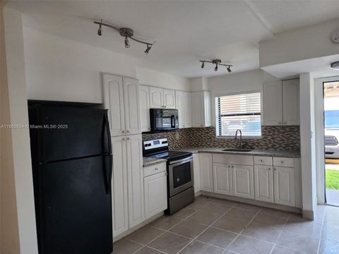 Photo of 6020 Shakerwood Cir #103, Tamarac, FL 33319 (MLS # A11802604)