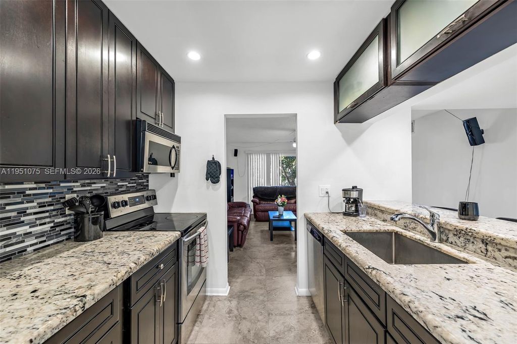 Photo of 10772 La Placida Dr #7-203, Coral Springs, FL 33065 (MLS # A11951075)