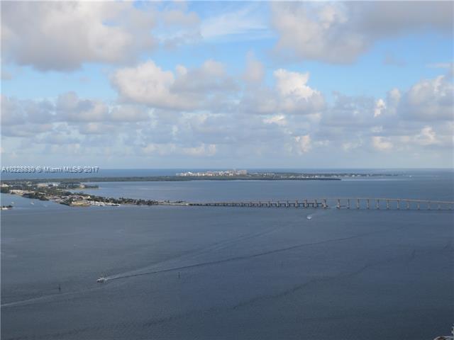 Impeccably furnished extra large 1 bedroom condo with spectacular wide water & city views from the 44th floor. The unit features marble flooring in the living/dining area & hardwood flooring in the bedroom, recessed lighting, Italian cabinets, granite countertops in the kitchen and bathroom, SS Wolf appliances, built-out walk in closet, black out shades & sheer white curtains in the bedroom, roman tub, & a newly installed glass shower door. Spectacular unit that won't last long!