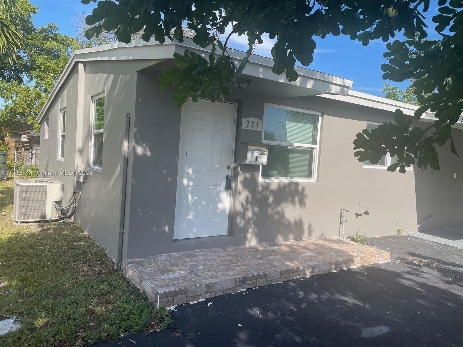 Location, Location, Location. Completely remodeled, contemporary executed to perfection. Tile throughout. some impact window on the front Exclusive neighborhood. Don't miss this one. 3 bedrooms, 2 b beautiful remodeled b bathrooms. bathrooms single house in a corner stand, ester in the prestigious COLLIER ESTATE FIFTH. Fully re-painted, new air conditioning unit, washer and dryer and much more.