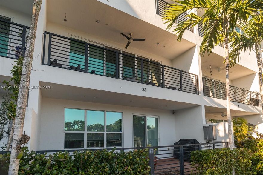 This excellent water front townhome is the height of elegance with Italian light fixtures, Italian tiles, and Italian features throughout.  The three bedroom, 2 full and 2 half bath home with 2 car garage and a family room on the ground floor looks over the North Fork of the Middle River with a view of a lovely Wilton Manors neighborhood from your large 2nd floor balcony or your large ground floor patio. You will enjoy the wonderful light that fills the home from the large sliders leading to the balcony and the expansive ten foot ceilings. The home features a natural gas stove, dryer and on-demand water heater, 12 foot kitchen island, and an oversized shower in the primary bath. There is a large two car garage with additional storage as well as plenty of storage in the home. The gated complex is accessed by visitors with an easy phone system and has a beautiful point of the river pool, spa, gym and stylish clubhouse.  The monthly maintenance is low and there are no pending assessments. The complex is very well maintained and enjoys a lovely entrance.