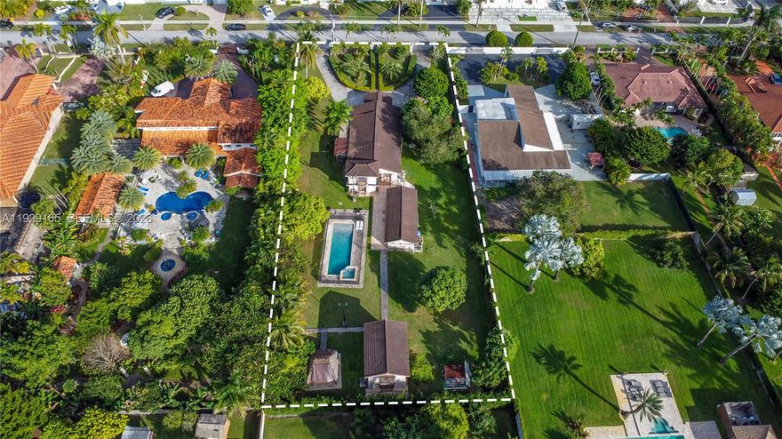 Rare 0.85-acre private estate (±37,060 SF) in West Miami featuring THREE distinct structures. Zoned 2300, offering strong land value and exceptional flexibility for multigenerational living, rental income, or redevelopment. The main residence offers a 4-bed, 2-bath layout with central air. Two additional structures include a 2-bed/1-bath guest house and a two-story 1-bed/1-bath ideal for office or extended living. The estate includes an in-ground pool, carport, and expansive driveway with ample space for RVs and boats—no HOA. Located near Belen Jesuit Preparatory School and minutes to major highways. Properties with multiple living quarters on nearly an acre inside Miami are rare. A true opportunity.