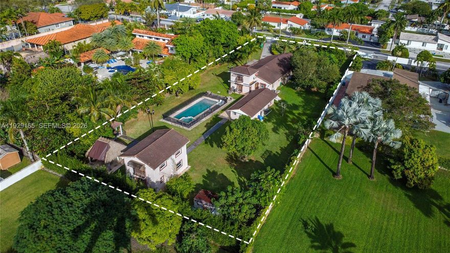 Rare 0.85-acre private estate (±37,060 SF) in West Miami featuring THREE distinct structures. Zoned 2300, offering strong land value and exceptional flexibility for multigenerational living, rental income, or redevelopment. The main residence offers a 4-bed, 2-bath layout with central air. Two additional structures include a 2-bed/1-bath guest house and a two-story 1-bed/1-bath ideal for office or extended living. The estate includes an in-ground pool, carport, and expansive driveway with ample space for RVs and boats—no HOA. Located near Belen Jesuit Preparatory School and minutes to major highways. Properties with multiple living quarters on nearly an acre inside Miami are rare. A true opportunity.