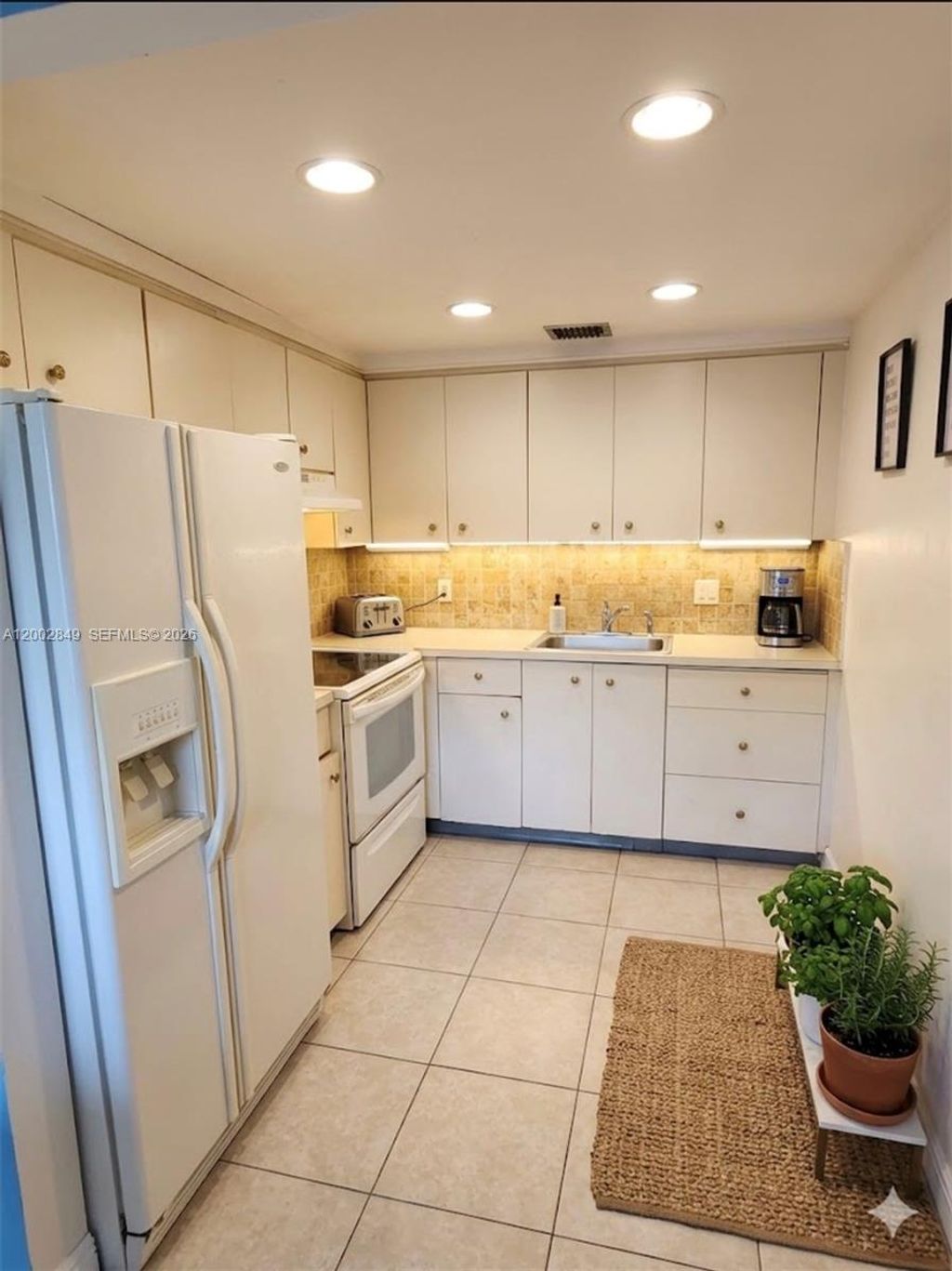 Photo of 1401 SW 134th Way #106C, Pembroke Pines, FL 33027 (MLS # A12002849)