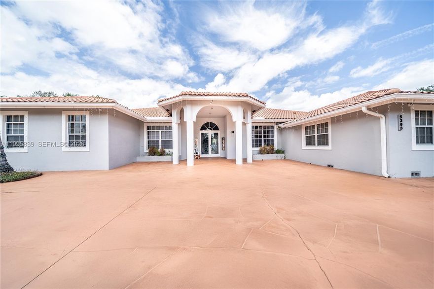 Welcome to one of Davie’s most versatile and private acre estates—located on a quiet cul-de-sac in Sunshine Acres and zoned for top-rated Cooper City schools with NO HOA.

This 5-bedroom, 5-bathroom home offers over 5,000 sq ft of upgraded living space with soaring 10–12 ft ceilings, a split floor plan, and seamless indoor-outdoor flow designed for both everyday living and unforgettable entertaining.

Inside, enjoy a fully upgraded kitchen with waterfall island, smart Samsung appliances, new epoxy flooring, designer lighting, and a renovated primary suite featuring a spa-style bathroom with a standalone soaking tub and glass-enclosed shower.

Step outside to over 3,000 sq ft of covered patio space overlooking your private pool—complete with safety fencing and baby guard—creating the perfect setting for hosting, relaxing, or even private events and gatherings.

Situated on nearly 1 acre, this property offers unmatched flexibility; fenced/gated for privacy & security, space for expansion, RV/s boats and large families, hosting/outdoor venue as well as room for horses.

Additional features include two AC units, a new well water treatment system. One bathroom remains original—giving buyers the opportunity to personalize and add value to an already upgraded estate.

Optional: Available fully furnished for a true turnkey experience.

Owner Occupied/Do Not Disturb Owner!!