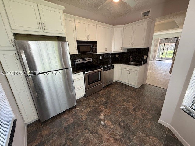 Photo of 7860 Lexington Club Blvd #B, Delray Beach, FL 33446 (MLS # A12093756)