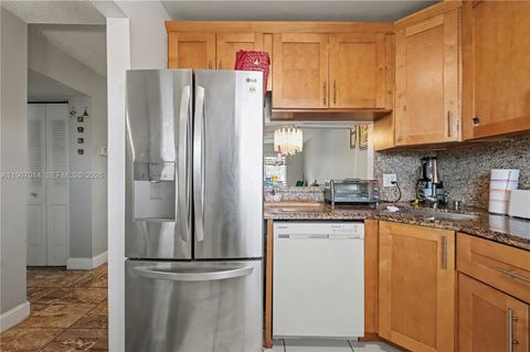 Photo of 8380 Lagos De Campo Blvd #307, Tamarac, FL 33321 (MLS # A11967014)