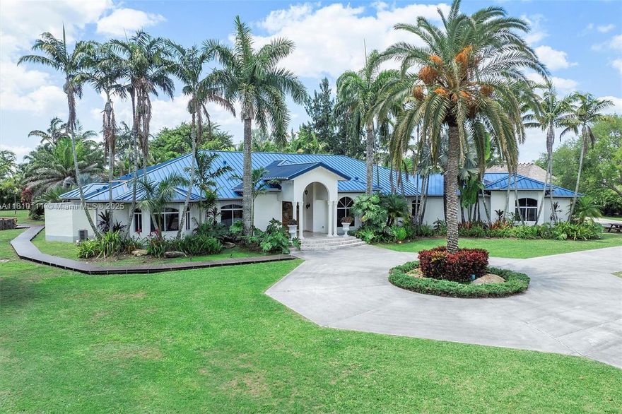 Tucked away on over two lush acres in the esteemed Redland agricultural district. Behind a gated entry, discover a grand 7,900+ sq ft custom-built residence designed for luxurious South Florida living and effortless entertaining. This spacious 5 bed, 5 1/2 bath, 3 car garage with a pool sits on over 2 acres of land with plenty of land to build a guest house. Home features half basket ball court, fire pit, play areas, theater room, office with library, recently renovated indoor/outdoor kitchen with top of the line appliances, indoor bar, master suite includes powder room, jacuzzi tub, steam shower, massive closet and French doors that overlook the resort style pool with the waterfall & jacuzzi. This estate offers a lifestyle of refined privacy, serenity, expansive living, and more.
