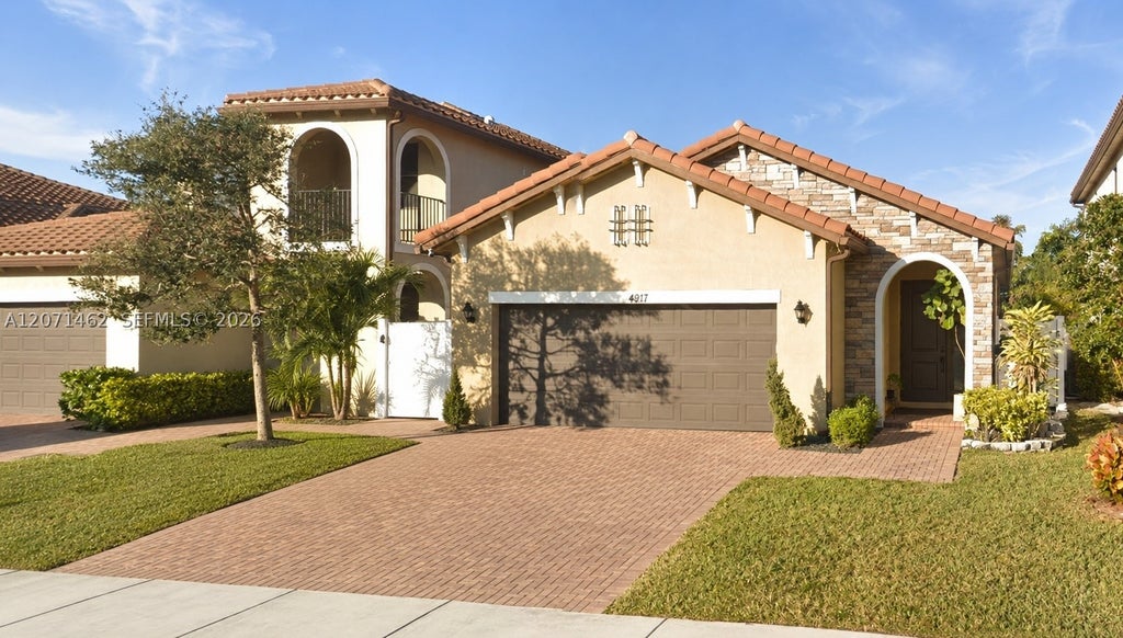 Photo of 4917 NW 51st Ter, Tamarac, FL 33319 (MLS # A12071462)