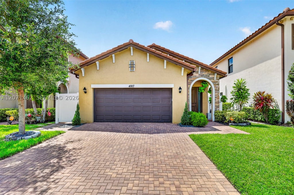 Photo of 4917 NW 51st Ter, Tamarac, FL 33319 (MLS # A12071462)