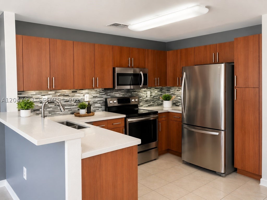 Photo of 3092 SW 129th Ter #102, Miramar, FL 33027 (MLS # A12047951)