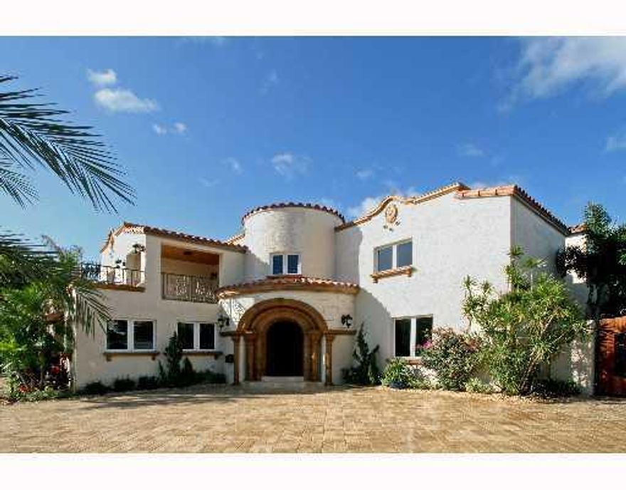 The best entertainment waterfront deal!  Newly rebuilt from top to bottom!  New addition, plumbing, electric, seawall, dock and electric boat lift. Moments to open bay! Resort style pool/spa/waterfall, covered patio w/SS grill/appliances. Cherry wood & ma rble floors, impact windows/doors, wood deck. Quality throughout.