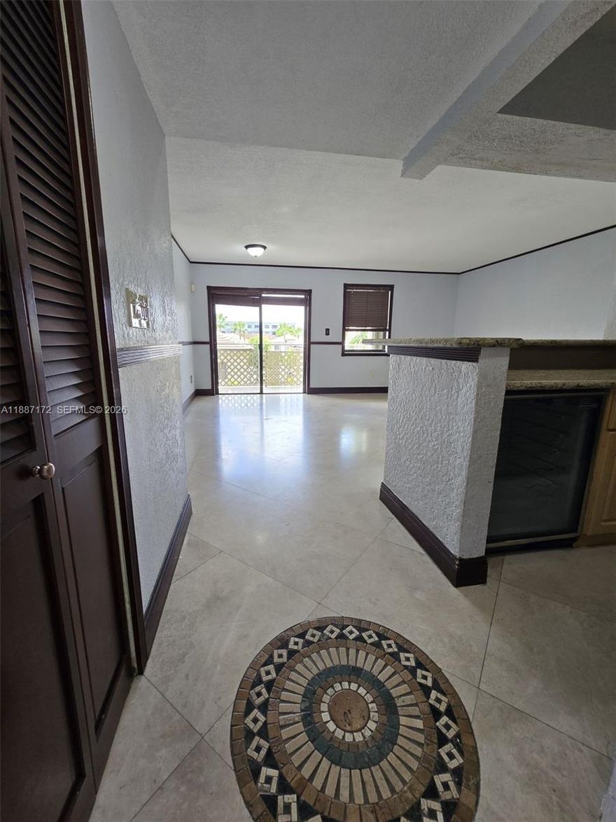 Experience elevated living in this beautifully 3-bedroom, 2-bath corner unit at Visions at Fountainbleau, featuring elegant marble flooring throughout, a private balcony perfect for relaxing evenings, a full-size washer and dryer inside the unit, and generous closet space in every room. Ideally situated just minutes from Miami International Airport, Doral, major expressways, and upscale dining, this gem offers the perfect balance of style, comfort, and unbeatable convenience.