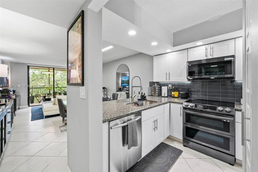 Step into this stunning 2BD/2BTH condo, fully remodeled in 2022 & 2024! Featuring impact windows, sleek new stove, microwave, fridge, washer, dryer, electric water heater, and A/C, plus stylish new window treatments. Enjoy fully remodeled resort-style master bath. Building amenities include: pool, hot tub, BBQ area, and additional storage. The building boasts a new roof, 40-year certification complete, and assessment PAID! Prime location—walk to major shopping! Don’t miss this turn key opportunity.