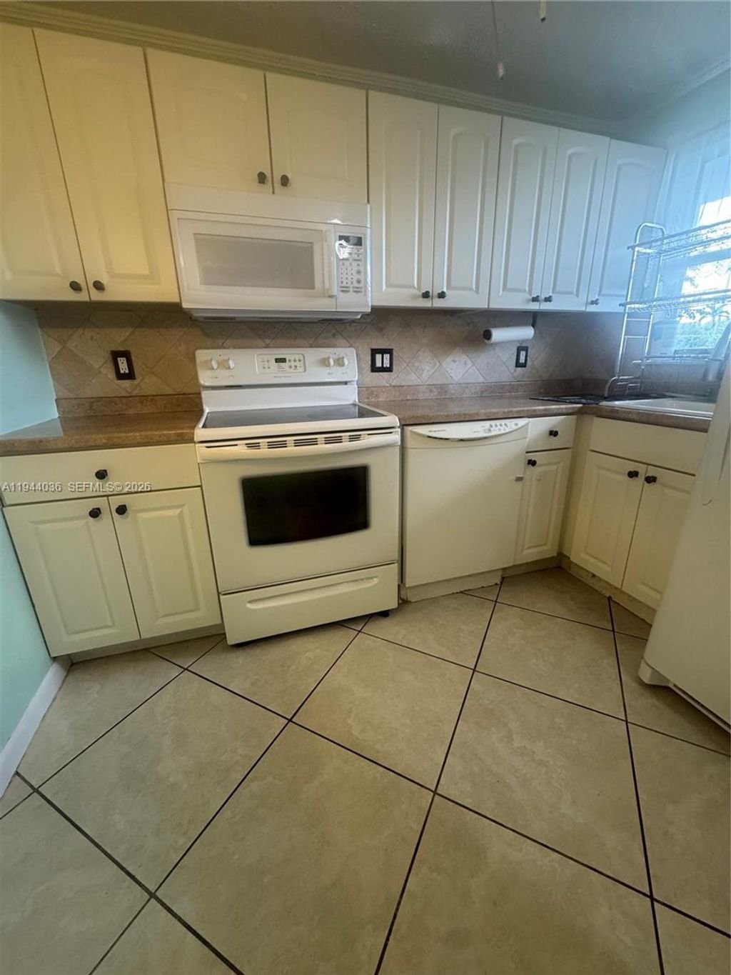 Photo of 8590 Sunrise Lakes Blvd #109, Sunrise, FL 33322 (MLS # A11944036)