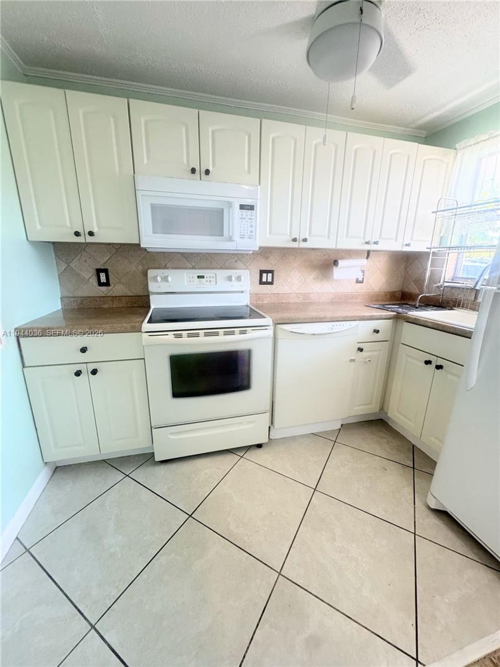 Photo of 8590 Sunrise Lakes Blvd #109, Sunrise, FL 33322 (MLS # A11944036)