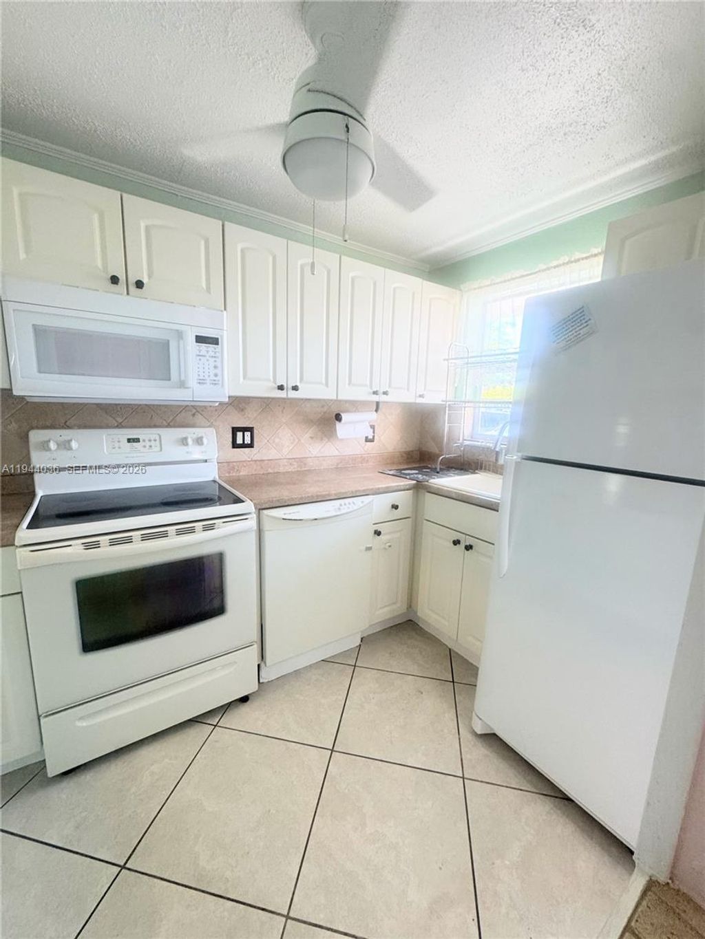 Photo of 8590 Sunrise Lakes Blvd #109, Sunrise, FL 33322 (MLS # A11944036)